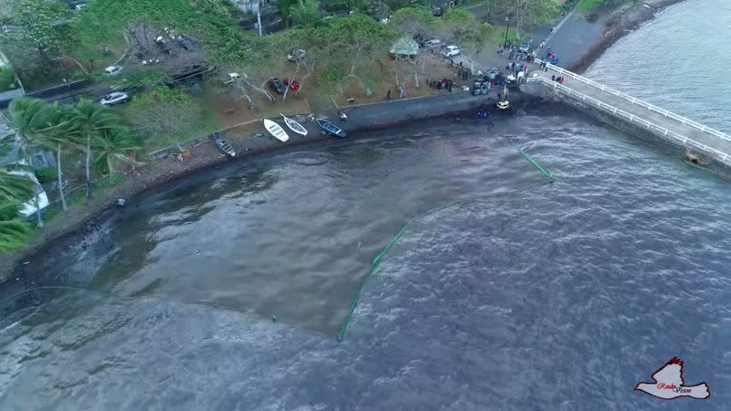 A general view shows the leaked oil from the bulk carrier ship MV Wakashio, after it ran aground on a reef, at Bois des Amourettes