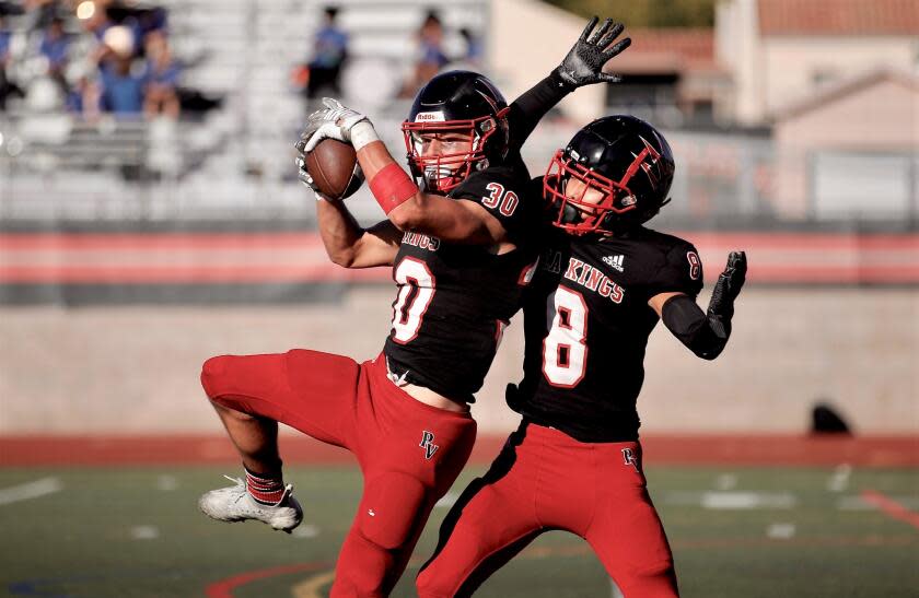 Palos Verdes free safety Niko Tsangaris intercepts a hail mary pass at the 10-yard line to end the first half Friday.