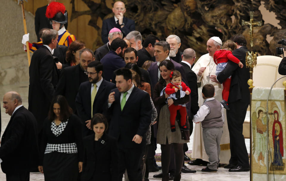 Pope Francis meets members of the Neocatechumenal Way missionary movement, in the Paul VI hall, at the Vatican, Saturday, Feb. 1, 2014. Francis met with thousands members of the Neocatechumenal Way, a community founded in Spain in the 1960s that seeks to train Catholic adults in their faith and is known for sending large families as missionaries around the world. (AP Photo/Riccardo De Luca)