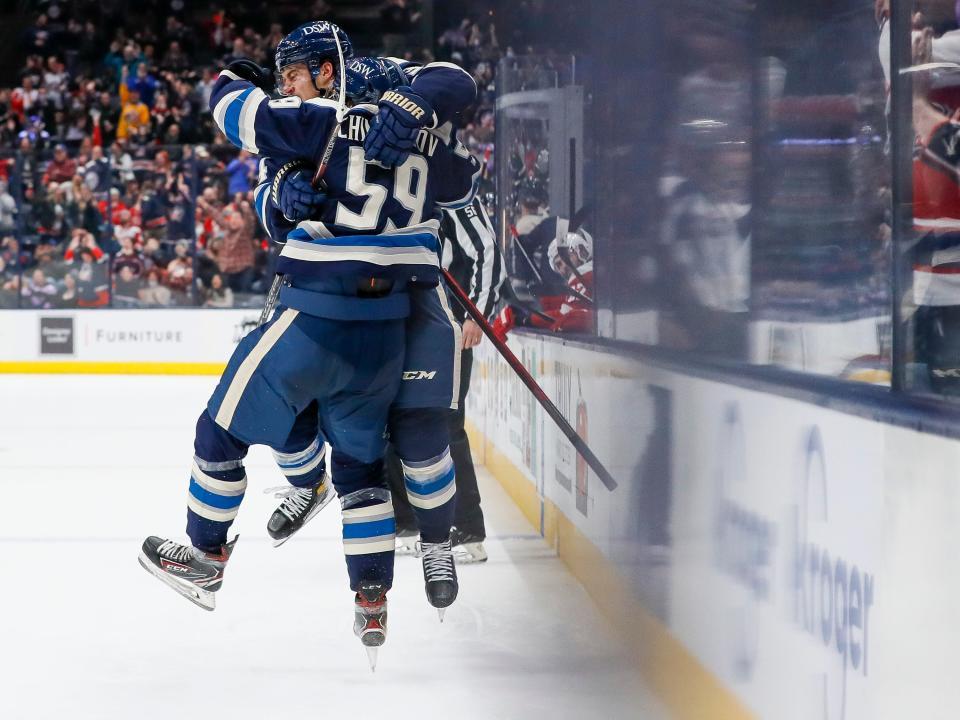 Columbus Blue Jackets right wing Yegor Chinakhov (59) celebrates scoring his first NHL goal with center Cole Sillinger (34) during the third period of the hockey game against the Detroit Red Wings at Nationwide Arena in Columbus on Monday, Nov. 15, 2021. The Blue Jackets won 5-3.