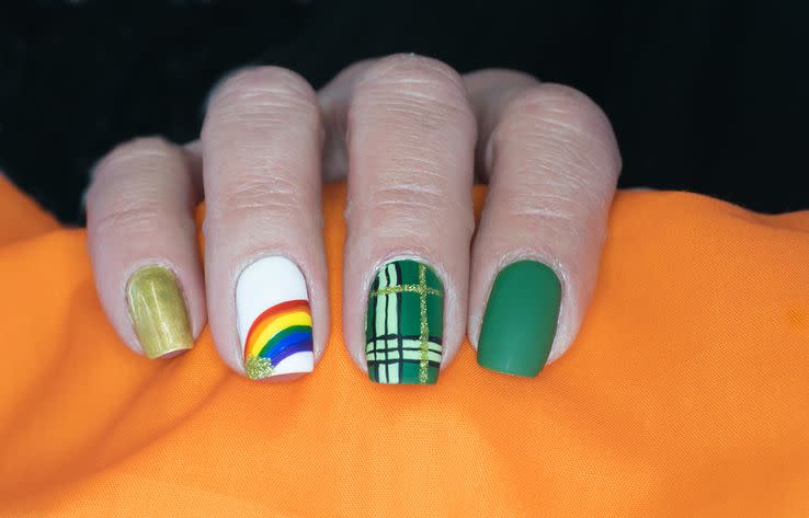 st patricks day themed nail art with a rainbow and green plaid design