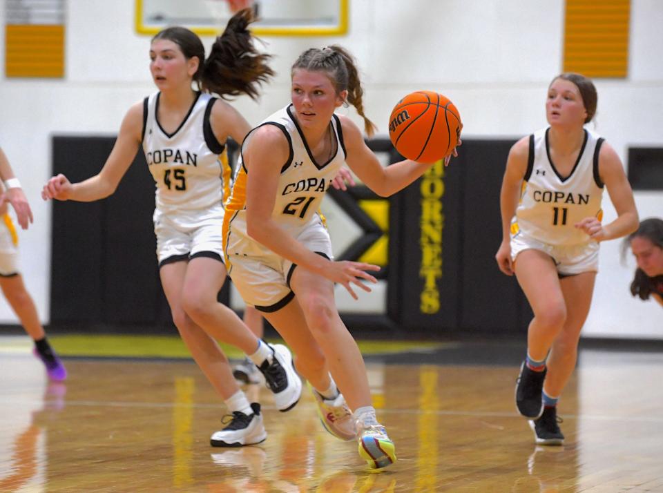 Copan High School's Elyzabeth Odum (21) drives toward the basket during basketball action in Copan earlier in the season. Copan is hosting its annual Copan Basketball Tournament Dec. 4-9, 2023. The Lady Hornets fell to Foyil, 38-35. The Hornets defeated Bluejacket 55-40.