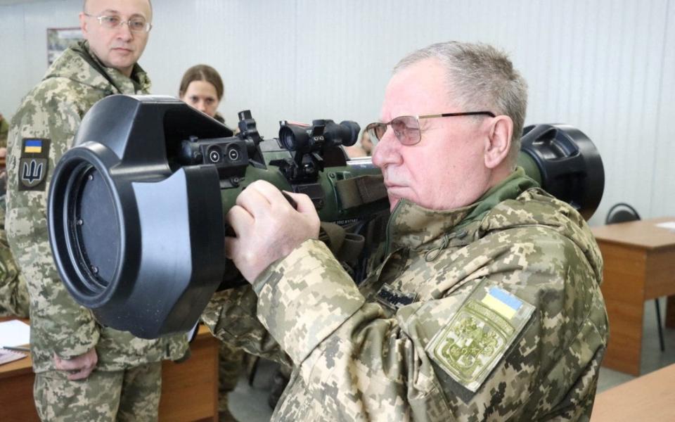Pavlo Tkachuk, head of a National Army Academy in Ukraine, holds a next generation light anti-tank weapon, which has been supplied by Great Britain, during a training session for Ukrainian service members in Lviv, western Ukraine