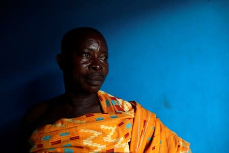 Chief Nana Boateng poses for a photograph wearing traditional attire at his house in Bawdie