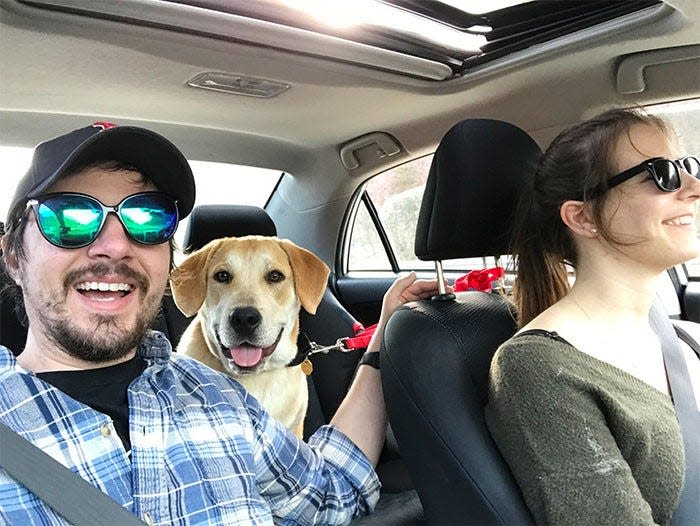 Ringwood couple Ian Azeredo and Linda Farkas ride with Otter, adopted in spring 2020 from the St. Hubert's Animal Welfare Center in Madison.