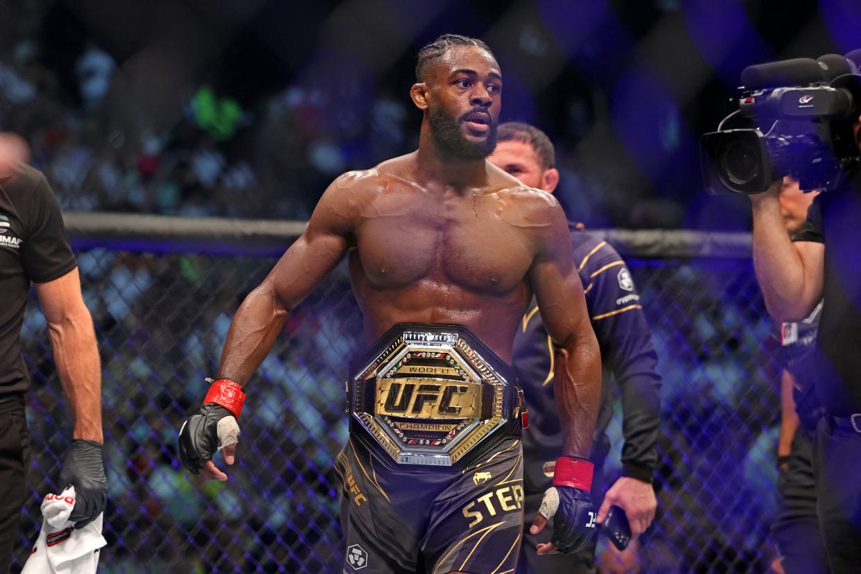 Aljamain Sterling wears the title belt after defeating TJ Dillashaw in the bantamweight championship at the Ultimate Fighting Championship (UFC) event at the Etihad Arena in Abu Dhabi on October 22, 2022. (Photo by Giuseppe CACACE / AFP) (Photo by GIUSEPPE CACACE/AFP via Getty Images)