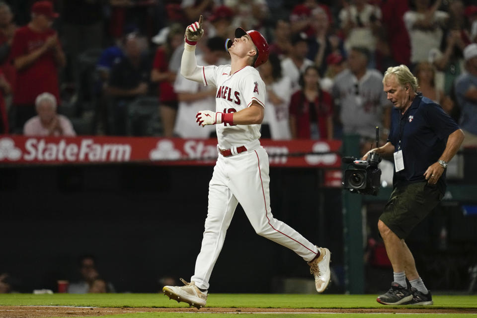 Los Angeles Angels' Mickey Moniak (16) runs the bases after hitting a home run during the fifth inning of a baseball game against the Seattle Mariners in Anaheim, Calif., Friday, Aug. 4, 2023. Mike Moustakas also scored. (AP Photo/Ashley Landis)