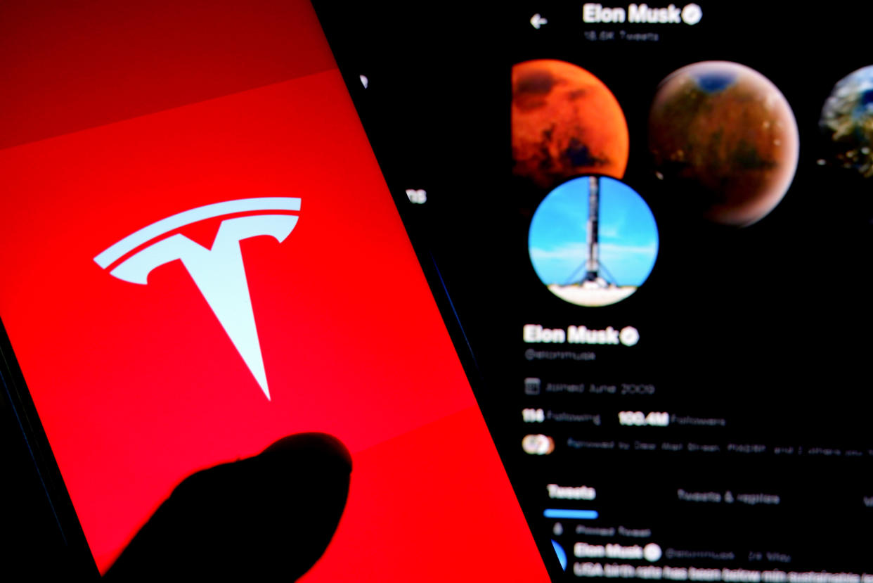 INDIA - 2022/07/07: In this photo illustration, a Tesla logo is displayed on a smartphone screen with Elon Musk Twitter page in the background. (Photo Illustration by Avishek Das/SOPA Images/LightRocket via Getty Images)