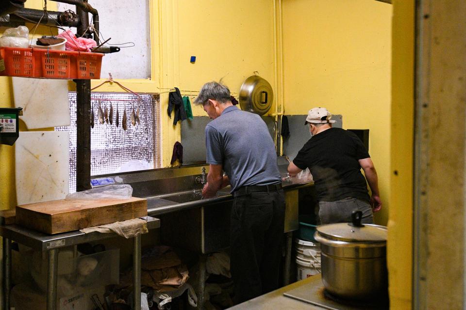 Residents of single-room occupancy buildings in San Francisco's Chinatown prepare food in their shared kitchen. So-called SROs are one of the oldest forms of affordable housing in San Francisco. They feature 10 by 10 ft rooms which, in many cases, are occupied by entire families. A single building often houses more than 50 people, with only a few communal bathrooms and kitchens. Since the COVID-19 outbreak began in America, many residents of these cramped buildings have stayed shuttered indoors, largely avoiding both each other and COVID-19 testing.