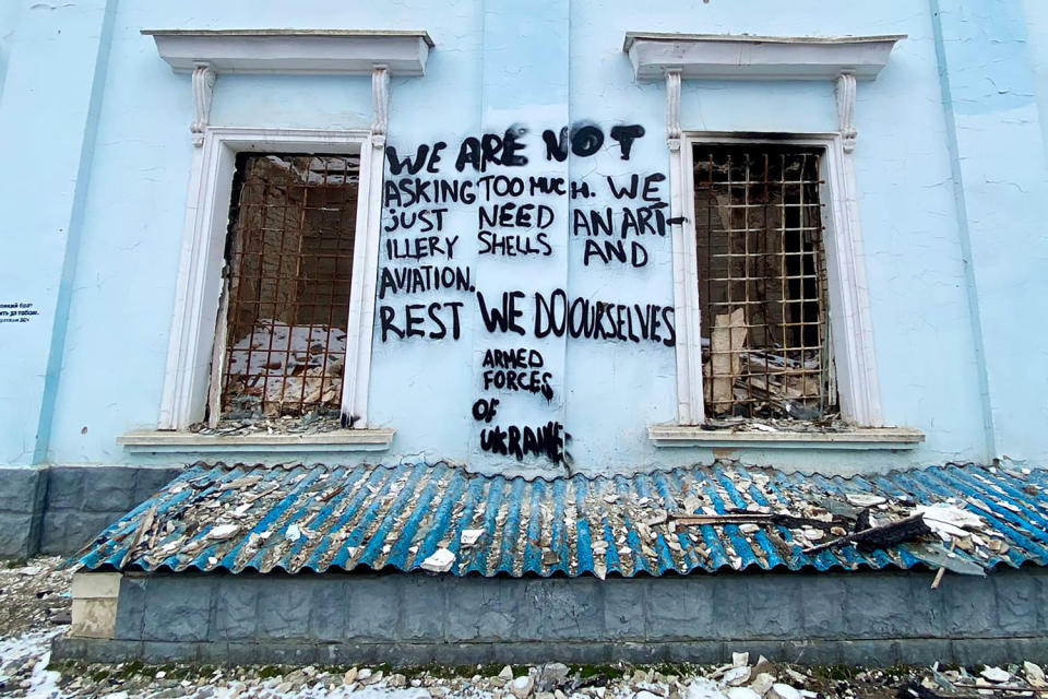 Graffiti on the town hall in Chasiv Yar.  (Charlotte Gardiner / NBC News)