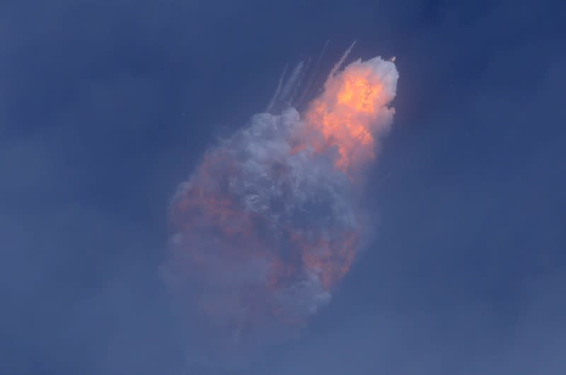 A SpaceX Falcon 9 rocket engine self-destructs after jettisoning the Crew Dragon astronaut capsule during an in-flight abort test after lift of from the Kennedy Space Center in Cape Canaveral