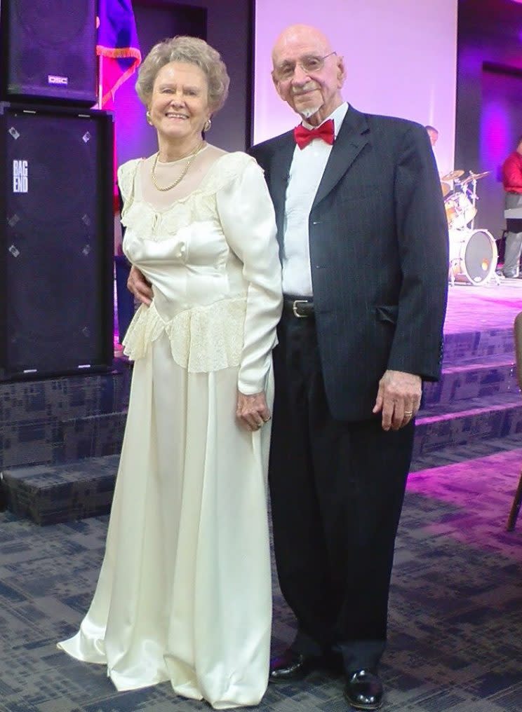 Ruthie McCoy, with husband Tom McCoy, in her original wedding dress from 1952. (Photo Source: Ashlyn Tubbs/KCBD NewsChannel 11)