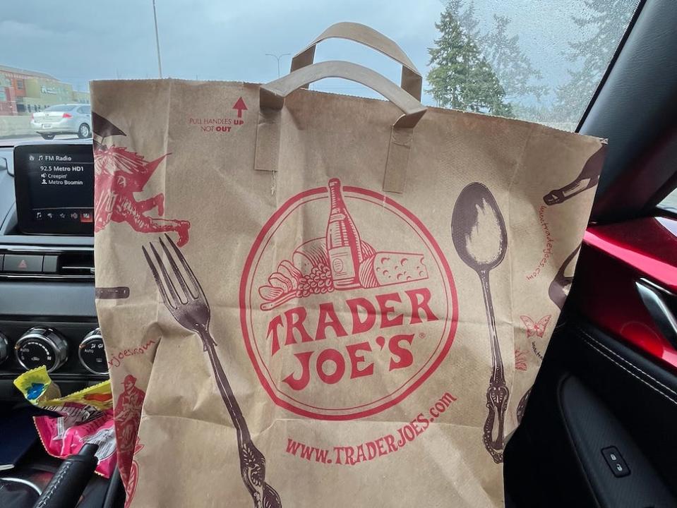 trader joe's shopping bag in a car