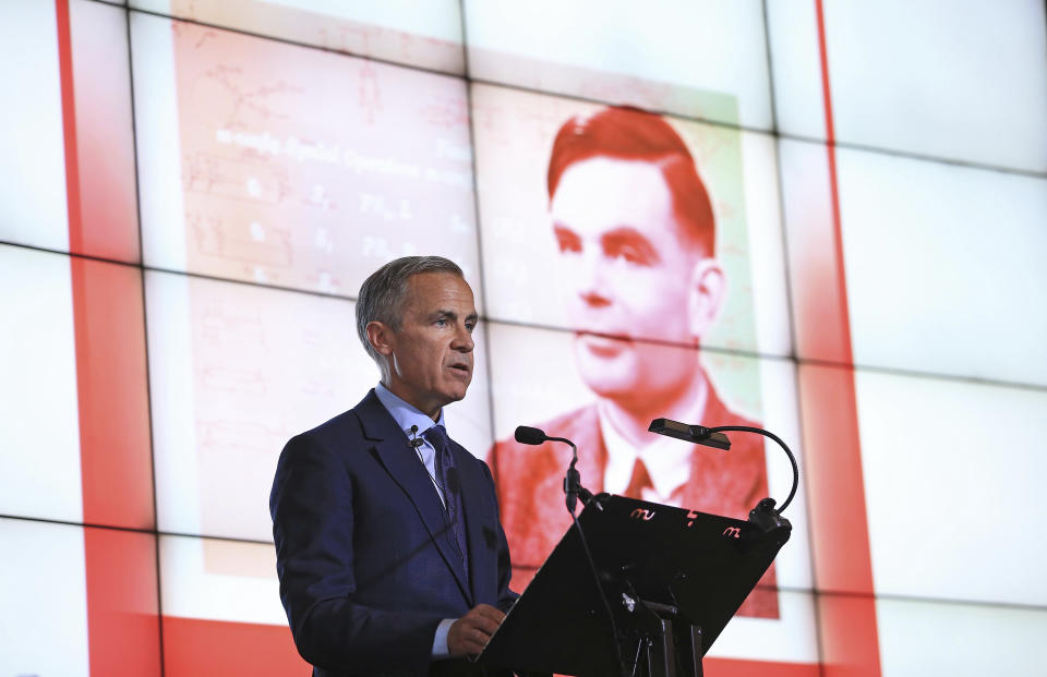 Governor of the Bank of England, Mark Carney speaks, during the announcement that Second World War code-breaker Alan Turing has been selected to feature on the new 50 pound notes, at the Science and Industry Museum, in Manchester, England, Monday July 15, 2019. The Bank of England has chosen codebreaker and computing pioneer Alan Turing as the face of the country’s new 50 pound note. Governor Mark Carney said Monday that Turing was “a giant on whose shoulders so many now stand.” Turing’s work cracking Nazi Germany’s secret communications helped win World War II, but after the war he was prosecuted for homosexuality, and died in 1954 after eating an apple laced with cyanide. (Peter Byrne/PA via AP)