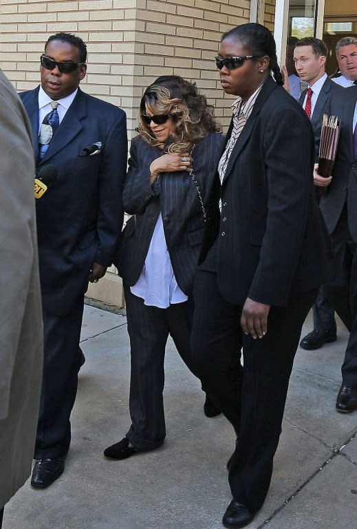 Tyka Nelson, the sister of Prince, and her attorneys exit the Carver County court house after the first hearing on the musician's estate on May 2, 2016 in Chaska, Minnesot