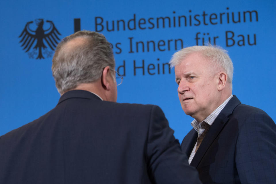 15 March 2020, Berlin: Hans-Georg Engelke (l), State Secretary in the Federal Ministry of the Interior, for Building and Homeland Affairs, and Horst Seehofer (CSU), Federal Minister of the Interior, speak at a press conference in the Federal Ministry of the Interior about the borders that will be closed from tomorrow. From Monday morning, Germany will close its borders with France, Austria and Switzerland. Photo: JÃ¶rg Carstensen/dpa (Photo by JÃ¶rg Carstensen/picture alliance via Getty Images)