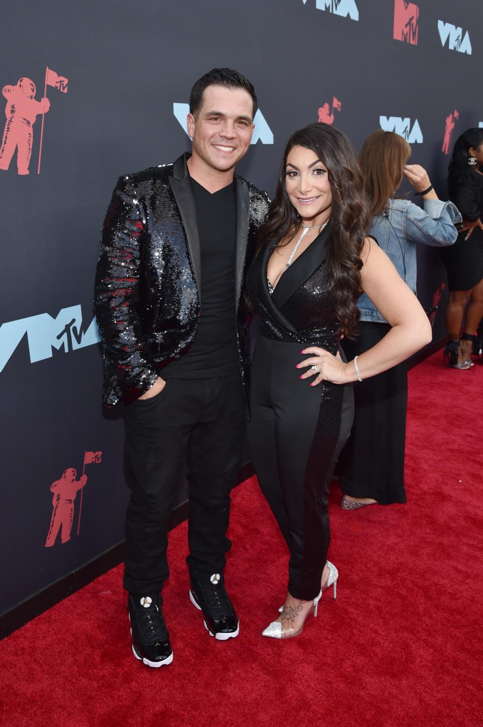 <h1 class="title">Christopher Buckner and Deena Nicole Cortese</h1><cite class="credit">Photo: Getty Images</cite>