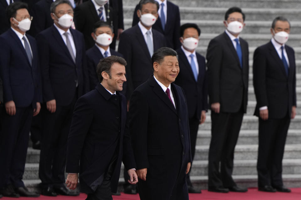 FILE- French President Emmanuel Macron walks with Chinese President Xi Jinping during a welcome ceremony held outside the Great Hall of the People in Beijing, Thursday, April 6, 2023. Xi will start his Europe tour in Paris on May 6-7, 2024, meeting with Macron, who has been stressing the idea of European strategic autonomy from the U.S. (AP Photo/Ng Han Guan, Pool, File)
