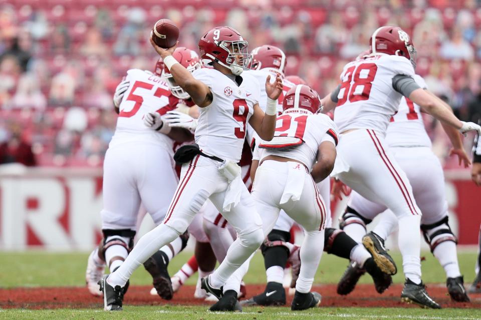 Alabama quarterback Bryce Young (9) throws a pass against Arkansas at Donald W. Reynolds Razorback Stadium.