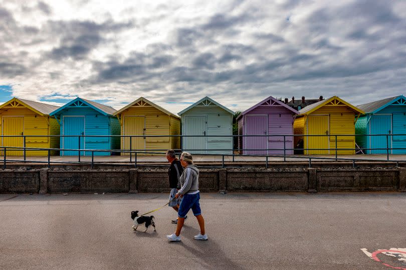 Colourful beach huts along the Promenade in  Fleetwood, Lancashire.