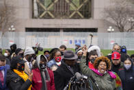 Naisha Wright, aunt of Daunte Wright, right, yells the name of her deceased nephew during a news conference outside the Hennepin County Government Center, Tuesday, April 13, 2021, in Minneapolis. Daunte Wright, 20, was shot and killed by police Sunday after a traffic stop in Brooklyn Center, Minn. (AP Photo/John Minchillo)