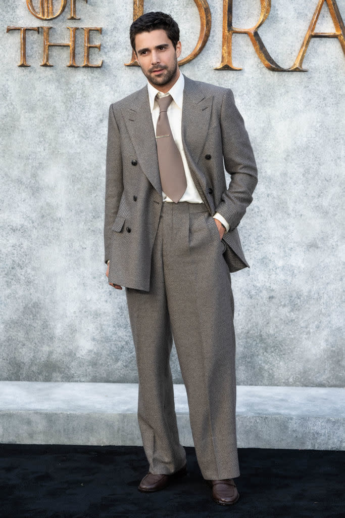 Fabien Frankel on the red carpet wearing a double-breasted suit with wide-legged trousers and a tie