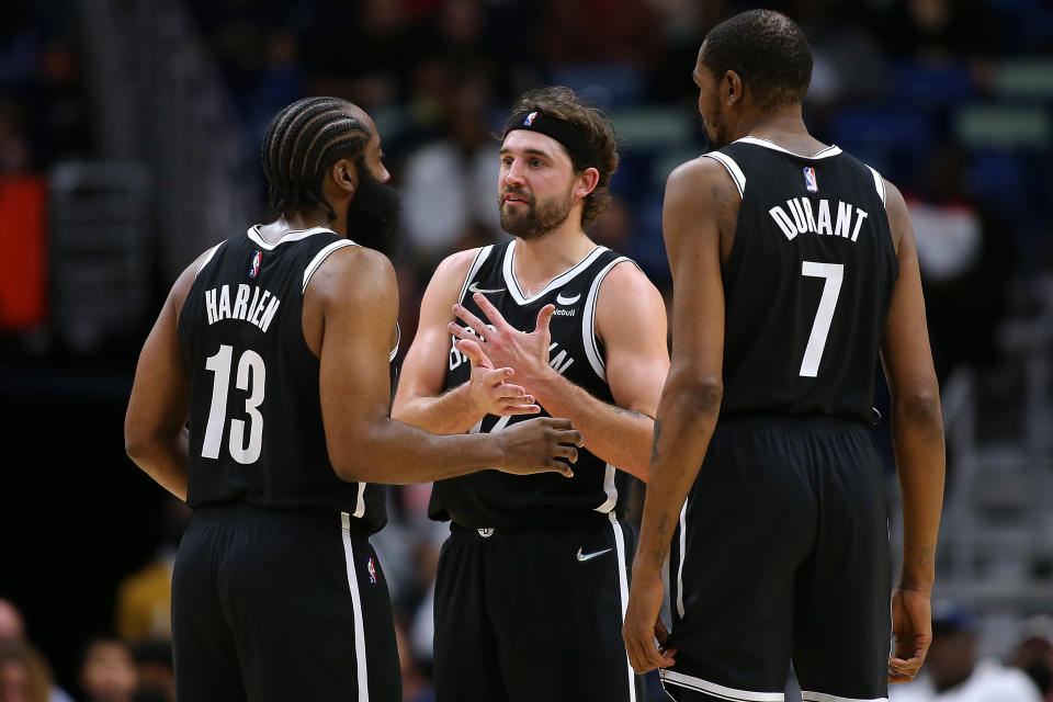 NEW ORLEANS, LOUISIANA - NOVEMBER 12: Joe Harris #12, James Harden #13 and Kevin Durant #7 of the Brooklyn Nets talk during a game  once morest the New Orleans Pelicans at the Smoothie King Center on November 12, 2021 in New Orleans, Louisiana. NOTE TO USER: User expressly acknowledges and agrees that, by downloading and or using this Photograph, user is consenting to the terms and conditions of the Getty Images License Agreement. (Photo by Jonathan Bachman/Getty Images)