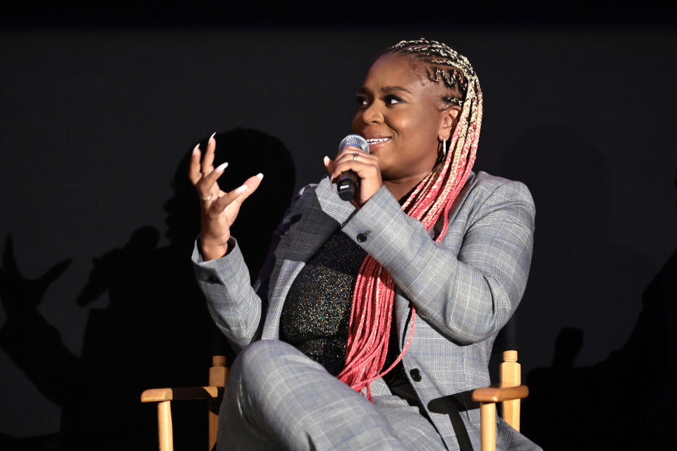 Woman talking on stage