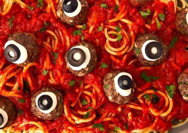 <p>Dinner on Halloween can be anything but regular—it's gotta be spooky! We're obsessed with turning ordinary meatballs into scary works of art by making them look like monster eyeballs. All you need is some mozzarella (fresh works best since it's thicker) and black olives. </p><p>Get the <a href="https://www.delish.com/uk/cooking/recipes/a29221858/eyeball-pasta-halloween-dinner-recipe/" rel="nofollow noopener" target="_blank" data-ylk="slk:Eyeball Pasta;elm:context_link;itc:0;sec:content-canvas" class="link ">Eyeball Pasta</a> recipe.</p>