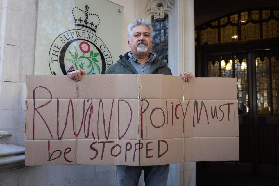 London, UK. 15th Nov, 2023. A protestor holds a placard outside the Supreme Court in London where the UK Government's Rwanda asylum policy was judged to be unlawful. Last April, the Court of Appeal ruled that Rwanda asylum policy was unlawful because the East African country was not a safe country. (Credit Image: © Tejas Sandhu/SOPA Images via ZUMA Press Wire) EDITORIAL USAGE ONLY! Not for Commercial USAGE!