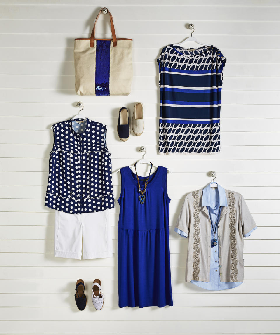 A collection of summer outfits and accessories displayed on a wall: a polka dot blouse with white shorts, a striped dress, a patterned shirt with a cardigan, a tote bag, and shoes