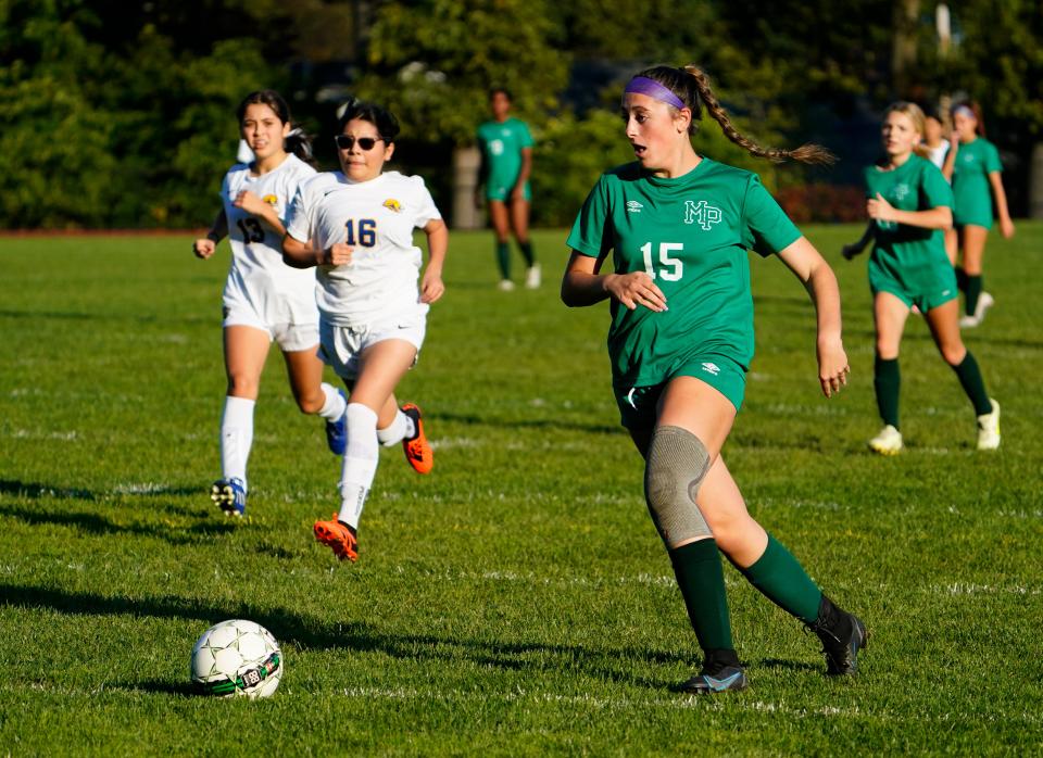 Samantha Weston of Midland Park, right, on her way to scoring a goal against Paterson Charter on Tuesday, Oct. 10, 2023, in Midland Park.