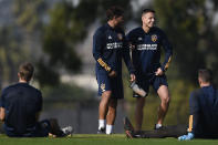 Los Angeles Galaxy's Javier "Chicharito" Hernández, right, speaks with Jonathan dos Santos during an MLS soccer training session in Carson, Calif., Thursday, Jan. 23, 2020. (AP Photo/Kelvin Kuo)