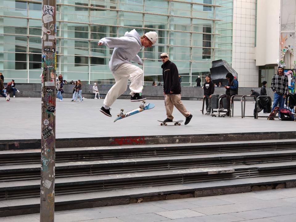 Person skateboarding down stone steps in Barcelona