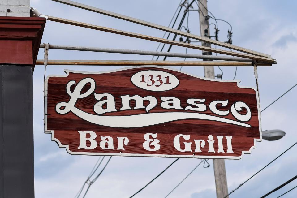 he Lamasco Bar & Grill's sign hangs outside the establishment.