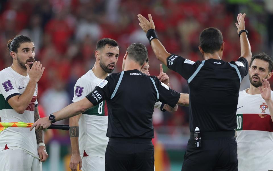 Players of Portugal argue with the referees during the FIFA World Cup 2022 quarter final soccer match - SHUTTERSTOCK