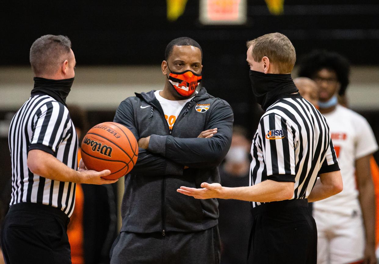 Lanphier boys basketball head coach Blake Turner talks with the referees during a break in play as the Lions take on Springfield in the first half during the semifinals of the Boys CS8 Tournament at Lober-Nika Gymnasium in Springfield, Ill., Friday, March 12, 2021. [Justin L. Fowler/The State Journal-Register] 