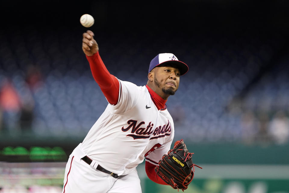 Washington Nationals starting pitcher Joan Adon throws during the first inning in the second game of a baseball doubleheader against the Arizona Diamondbacks at Nationals Park, Tuesday, April 19, 2022, in Washington. (AP Photo/Alex Brandon)