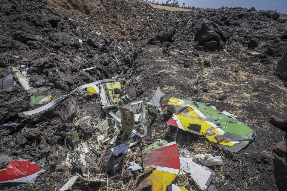 FILE - Wreckage lies at the scene of an Ethiopian Airlines flight of a Boeing 737 Max 8 plane that crashed shortly after takeoff at Hejere near Bishoftu, or Debre Zeit, some 50 kilometers (31 miles) south of Addis Ababa, Ethiopia, March 10, 2019. Boeing said Wednesday, April 24, 2024, that it lost $355 million on falling revenue in the first quarter, another sign of the crisis gripping the aircraft manufacturer as it faces increasing scrutiny over the safety of its planes and accusations of shoddy work. (AP Photo, File)