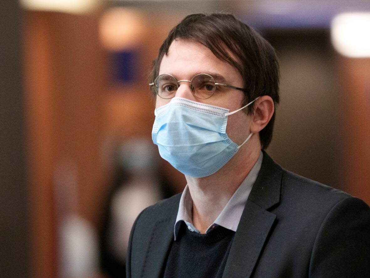 Gabriel Sohier-Chaput walks the halls of the courthouse in Montreal on Monday, Feb.28, 2022. (Paul Chiasson/The Canadian Press - image credit)