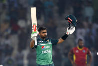 Pakistan's Babar Azam celebrates after scoring a century during the first one day international cricket match between Pakistan and West Indies at the Multan Cricket Stadium, in Multan, Pakistan, Wednesday, June 8, 2022. (AP Photo/Anjum Naveed)