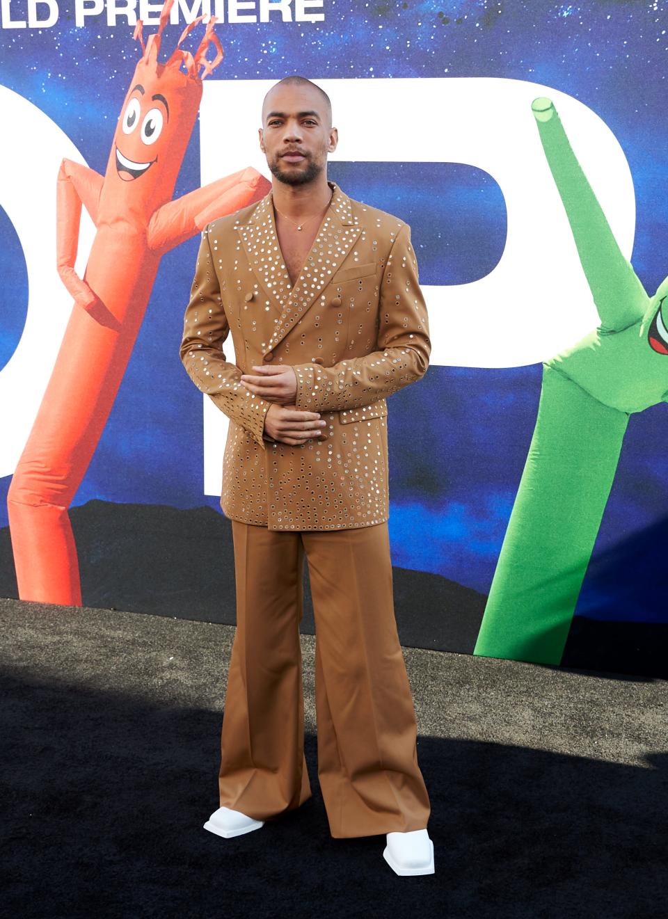Kendrick Sampson posing on the red carpet during the premiere of "NOPE."