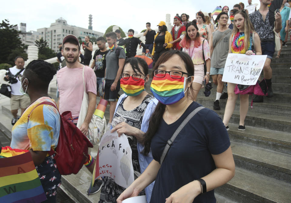 Participants march during the "Taiwan Pride March for the World!" at Liberty Square at the CKS Memorial Hall in Taipei, Taiwan, Sunday, June 28, 2020. This year marks the first Gay Pride march in Chicago 1970, and due to the COVID-19 lockdown, Taiwan is one of the very few countries to host the world's only physical Gay Pride. (AP Photo/Chiang Ying-ying)