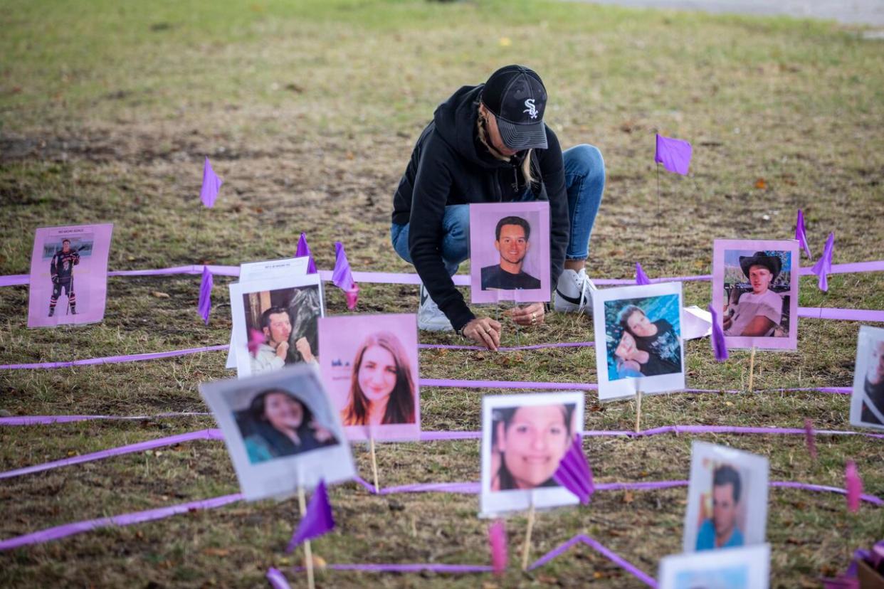 Pictures of people who died due to toxic, illicit drugs at a memorial in Vancouver on International Overdose Awareness Day, Aug. 31, 2023.  (Ben Nelms/CBC - image credit)