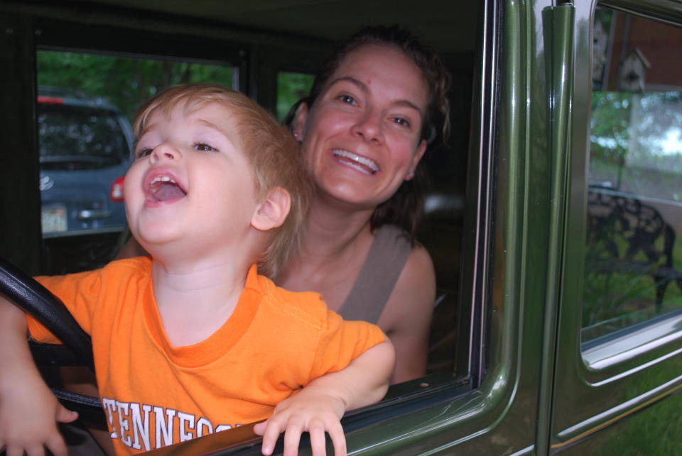 "You will notice that I am tired, unshowered, no make up and sporting one of those beautiful mommy pimples... but THANKFULLY my mom made me get in the photo because I am always behind the camera."  