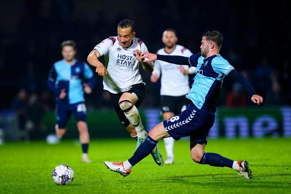 Derby County's Kane Wilson (left) and Wycombe Wanderers' Matt Butcher battle for the ball during the Sky Bet League One match at Adams Park, Wycombe <i>(Image: PA)</i>