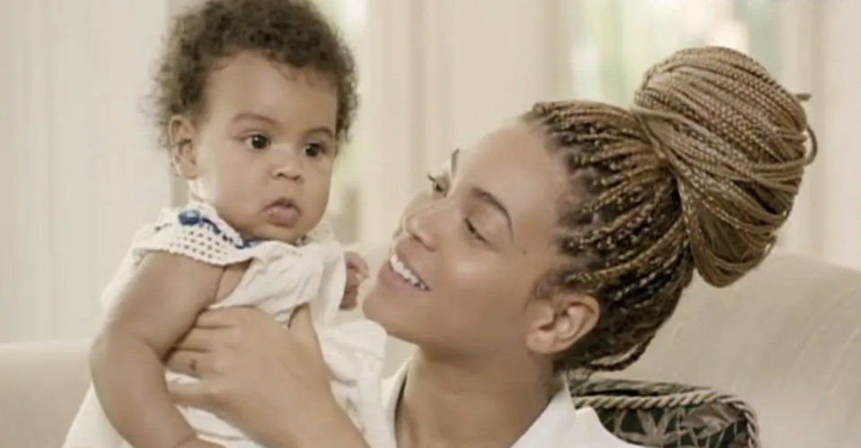 Beyoncé holds Blue Ivy as a baby