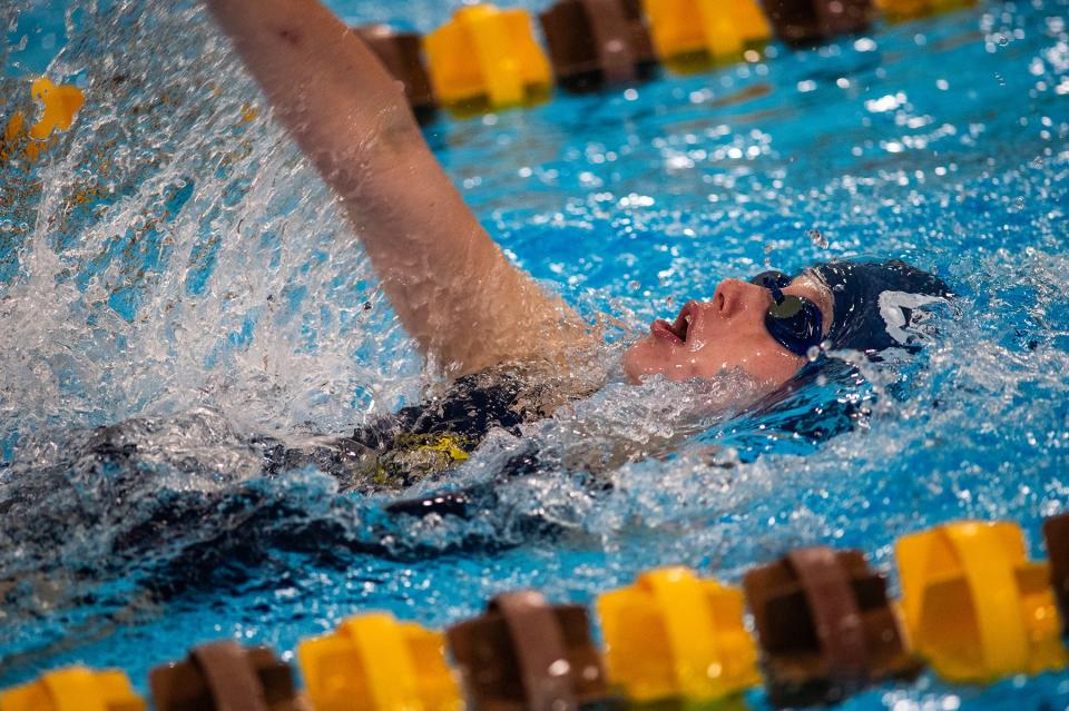 Lourdes' Skylar Mack competes in the 100 meter backstroke race during the Kingston and Our Lady of Lourdes girls swim meet at Kingston High School in Kingston, NY on Tuesday, October 10, 2023. KELLY MARSH/FOR THE POUGHKEEPSIE JOURNAL