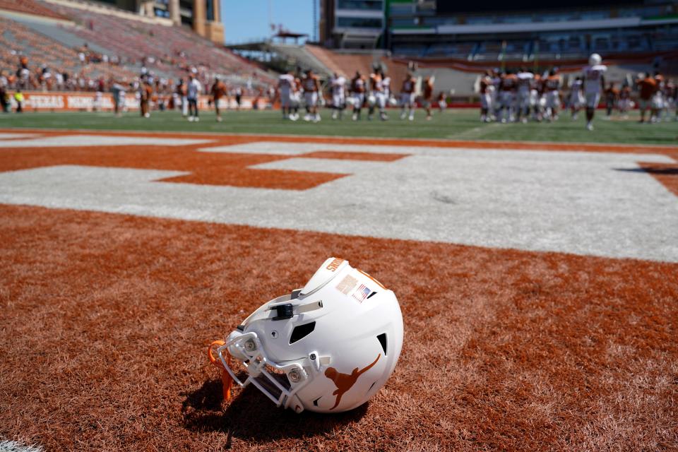 A Texas helmet lays on the field after the Orange-White spring game at Royal-Memorial Stadium on Saturday, April 24, 2021.