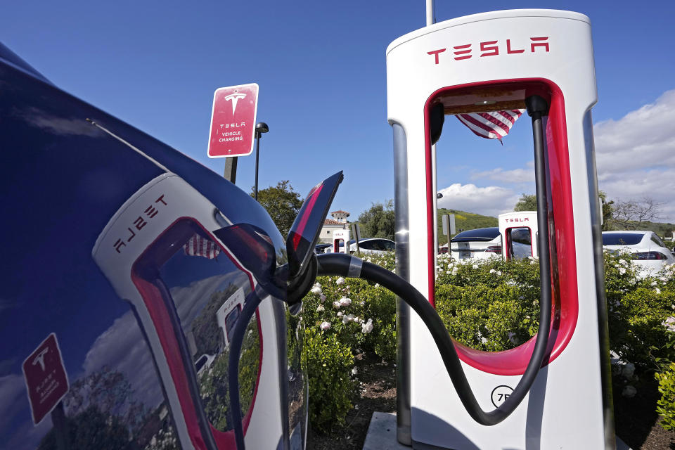 FILE — Tesla electric vehicles are seen at Tesla chargers, May 10, 2023, in Westlake, Calif. Connecticut's plan to halt the sale of new gas-powered cars by 2035 hit a speed bump, Tuesday, Nov. 28, 2023, after Gov. Ned Lamont pulled proposed regulations scheduled for a vote after it appeared there wasn't enough support. (AP Photo/Mark J. Terrill, File)